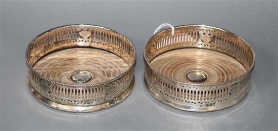 A pair of George V pierced silver wine coasters by Harry Freeman, London, 1911,